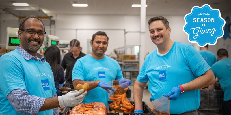 Schwab employees volunteering at a food bank.